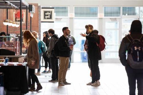 students talking in Kirkhof Center